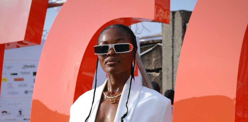 A person wearing stylish sunglasses at an event.